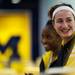 Michigan senior Kate Thompson smiles with other players at the Crisler Center on Monday, March 18. Daniel Brenner I AnnArbor.com
